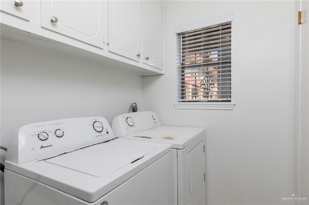 600 Toronto Avenue, Unit 14 McAllen, TX 78503 - Photo 11 of 14 Laundry room featuring cabinet space and independent washer and dryer
