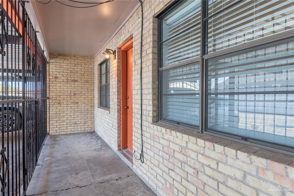 600 Toronto Avenue, Unit 14 McAllen, TX 78503 - Photo 12 of 14 Doorway to property with brick siding
