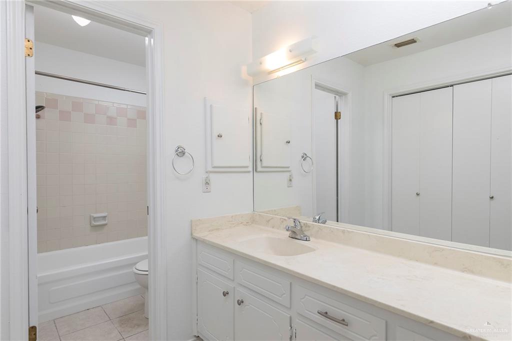 600 Toronto Avenue, Unit 14 McAllen, TX 78503 - Photo 8 of 14 Full bathroom featuring vanity, light tile patterned floors, and shower combination