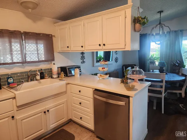 a kitchen with a sink and cabinets