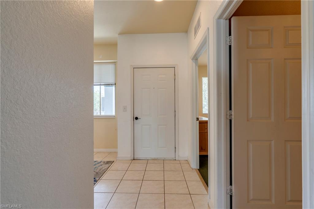 7930 Mahogany Run Lane, Unit 824 Naples, FL 34113 - Photo 14 of 40 a bathroom with a sink and a mirror