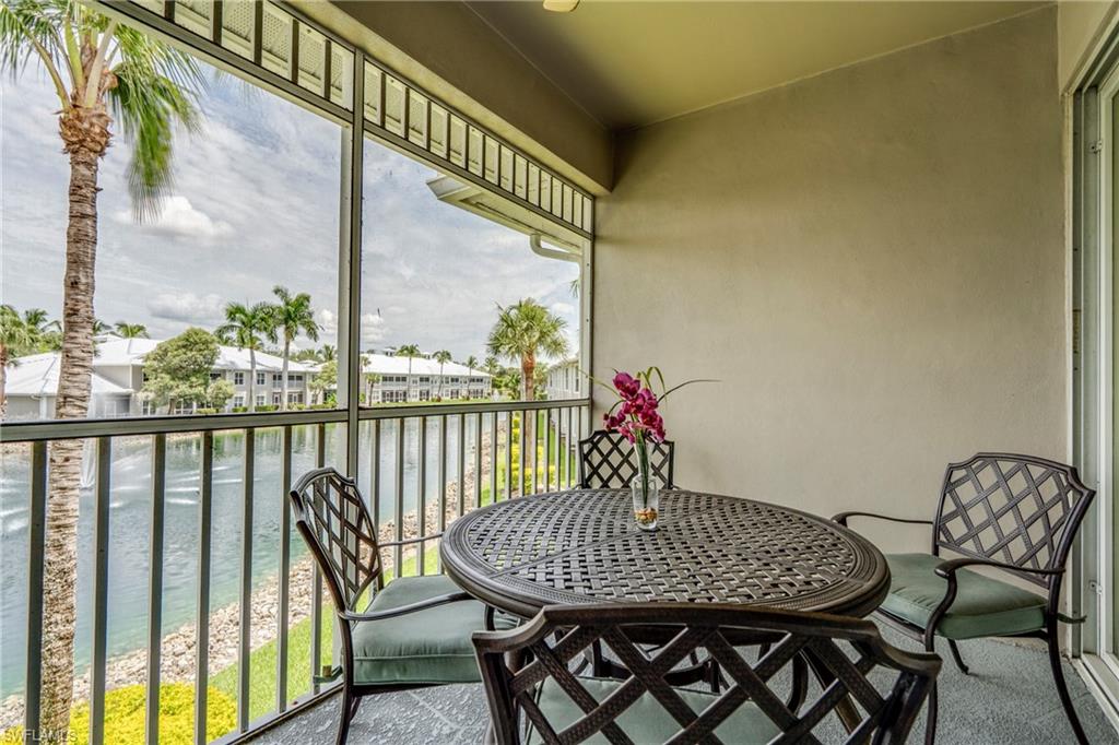7930 Mahogany Run Lane, Unit 824 Naples, FL 34113 - Photo 27 of 40 a view of a dining room with furniture window and outside view
