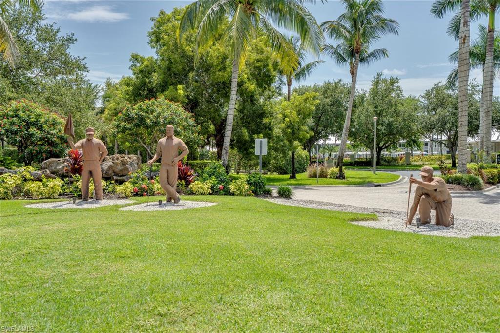 7930 Mahogany Run Lane, Unit 824 Naples, FL 34113 - Photo 3 of 40 a view of a park with large trees