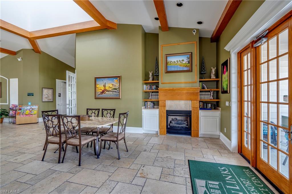 7930 Mahogany Run Lane, Unit 824 Naples, FL 34113 - Photo 37 of 40 a view of a livingroom with furniture and a fireplace