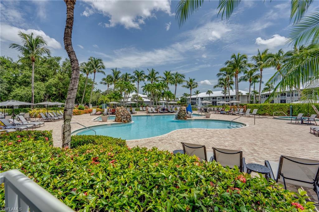 7930 Mahogany Run Lane, Unit 824 Naples, FL 34113 - Photo 38 of 40 a view of a swimming pool with a patio