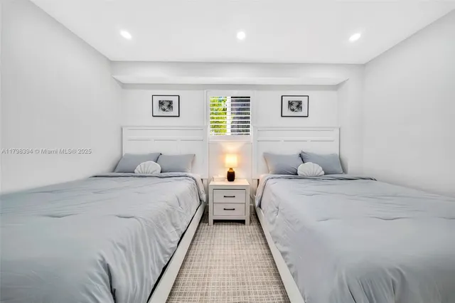 a kitchen with stainless steel appliances a refrigerator a sink a stove a microwave and cabinets