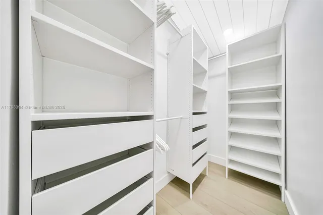 a bathroom with a sink a shower and a mirror