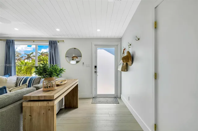 an aerial view of a house with a yard lake view and mountain view