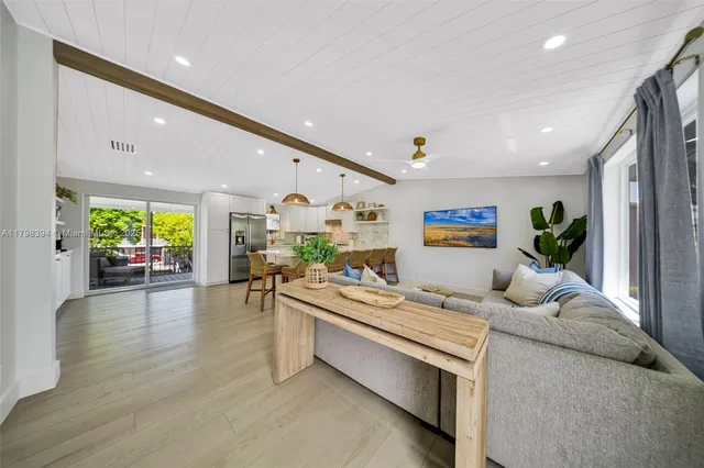 a kitchen with cabinets and stainless steel appliances