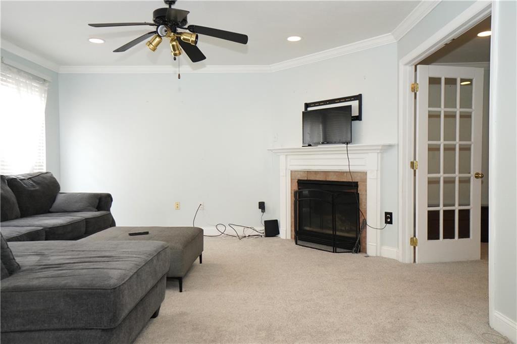 728 Mercer Street Pittsburgh, PA 15219 - Photo 10 of 27 a living room with furniture and a fireplace
