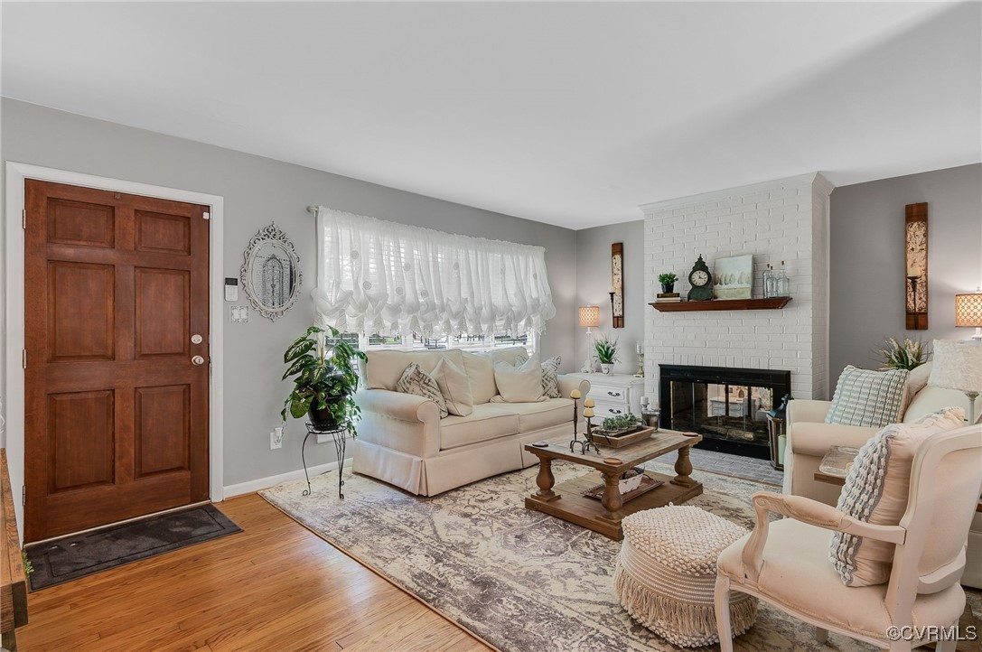 7503 Comet Road Henrico, VA 23294 - Photo 3 of 21 Living area with light wood-style floors and a bri