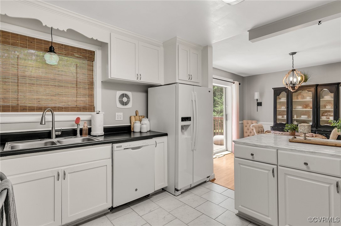 7503 Comet Road Henrico, VA 23294 - Photo 8 of 21 Kitchen featuring white appliances, white cabinetr