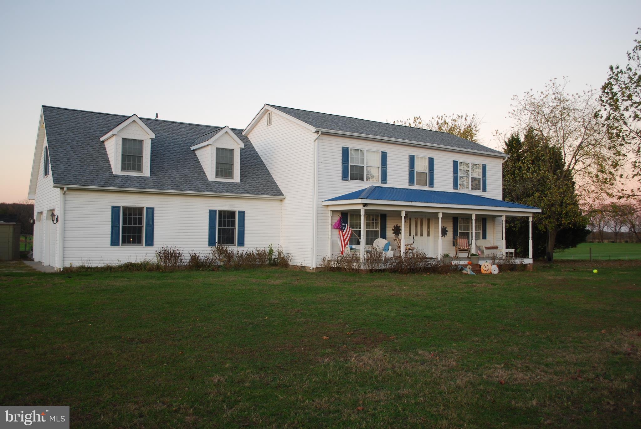 3401 Barclay Road Marydel, MD 21649 - Photo 1 of 3 a front view of a house with a garden