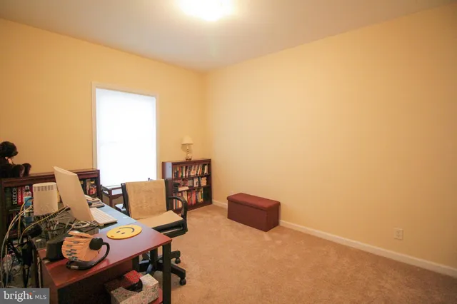 a view of a workspace with furniture