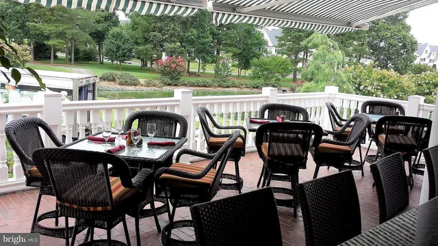 a view of an outdoor space with furniture and garden