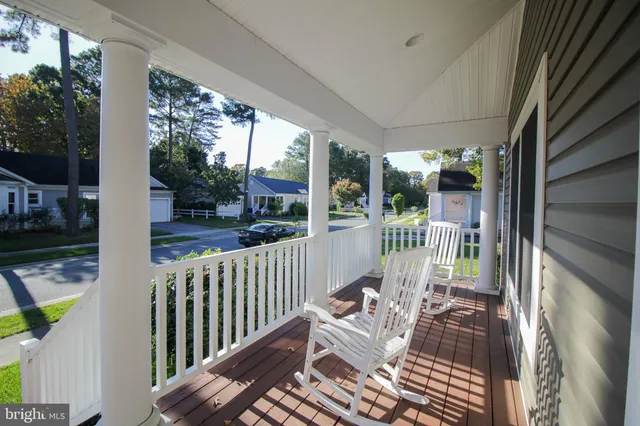 a view of a patio with a table chairs and backyard