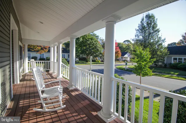 a view of a chairs and tables in the balcony
