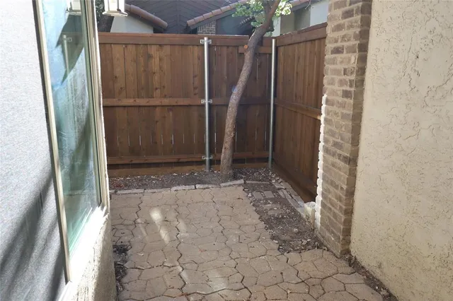 a view of outdoor space with wooden walls
