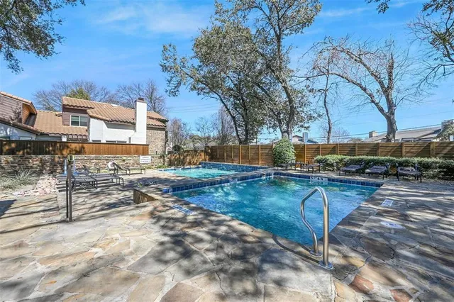 a view of a yard with cars