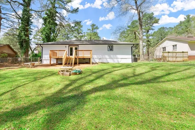 a house view with a sitting space and garden