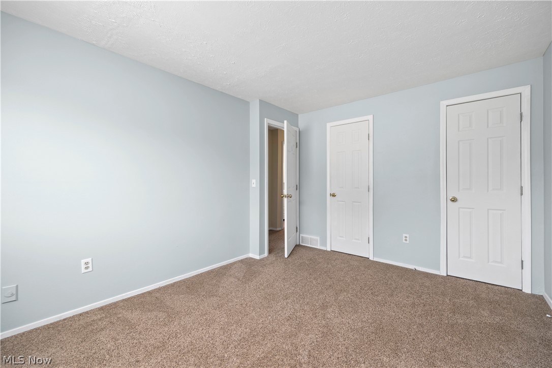 216 Moore Road Avon Lake, OH 44012 - Photo 21 of 22 Wall-to-wall carpeting with light-toned walls and white trim