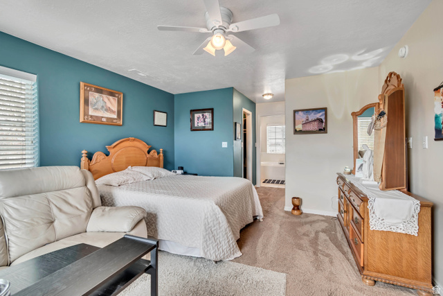 1697 North 500 West Mapleton, UT 84664 - Photo 24 of 50 Bedroom featuring light colored carpet, ensuite bathroom, and a ceiling fan