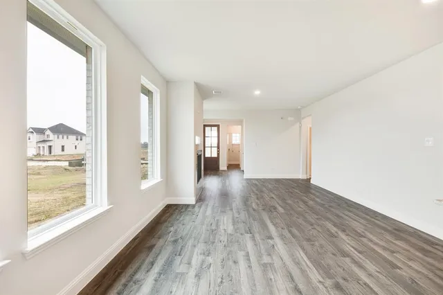 a view of gallery with wooden floor