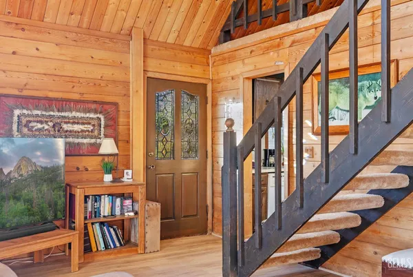 a view of a bedroom with furniture and a window