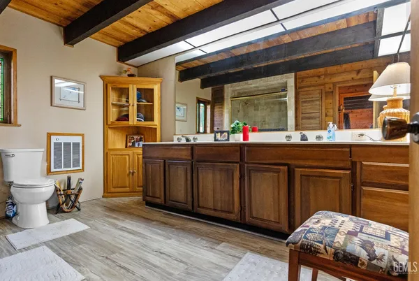 a bath room with a sink and a toilet