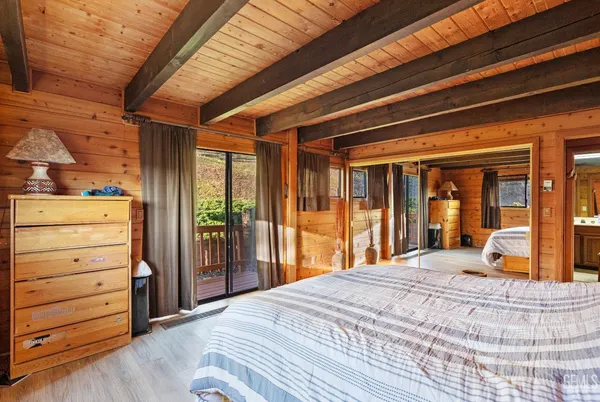 a view of balcony with wooden deck and floor