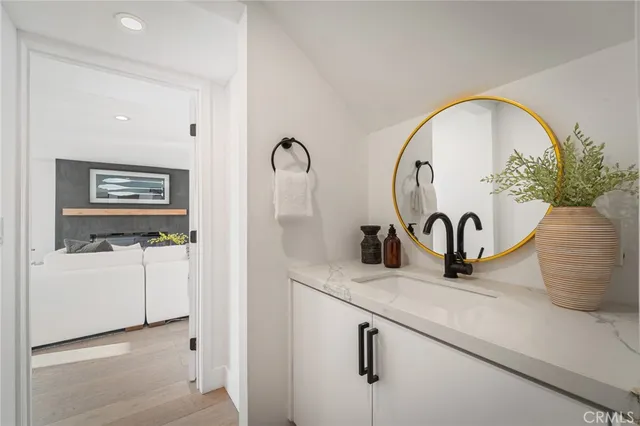 a bathroom with a sink and a mirror