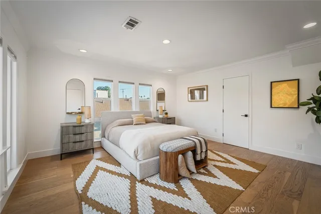 a bed room with a bed and dresser