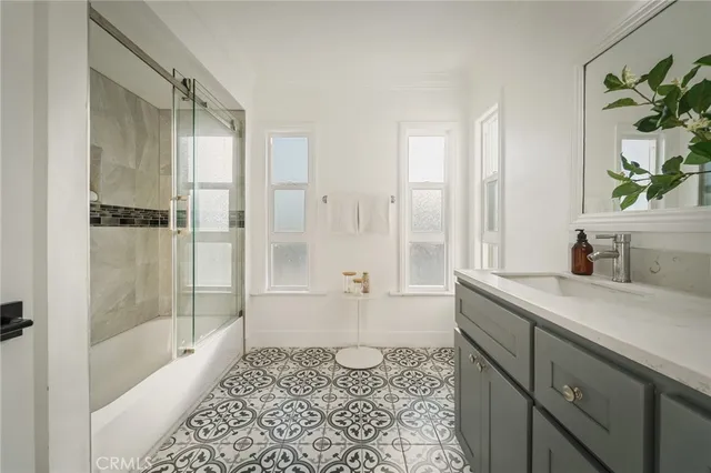 a spacious bathroom with a granite countertop sink a toilet and shower