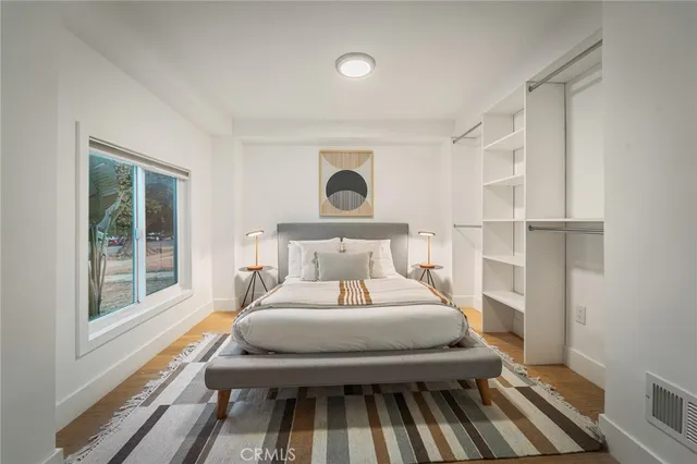 a bedroom with a bed and window