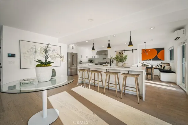 a living room with kitchen island furniture and a table