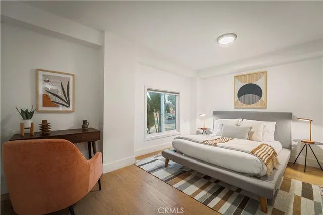 a bedroom with furniture and a window