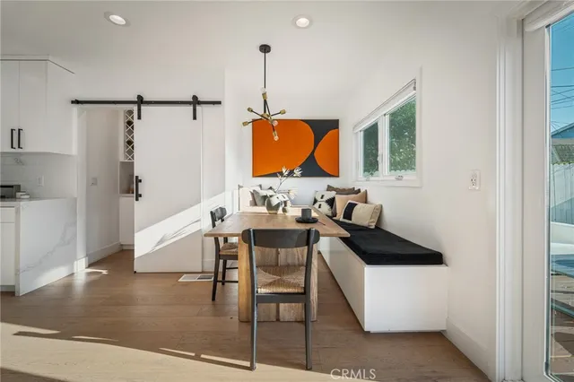 a view of kitchen with furniture and wooden floor