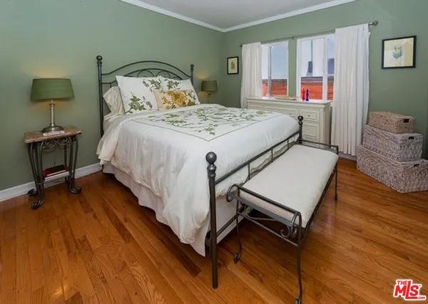 a bedroom with a bed and a table in it
