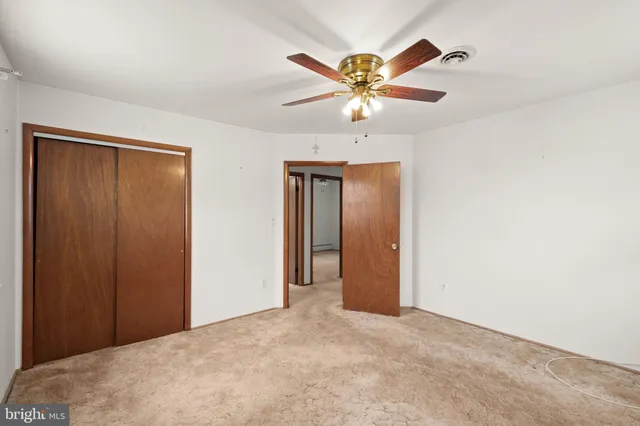 a view of a livingroom with a ceiling fan