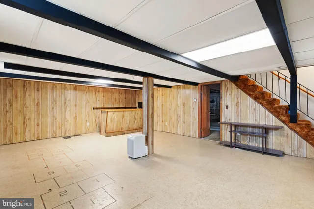 a view of an empty room with stairs