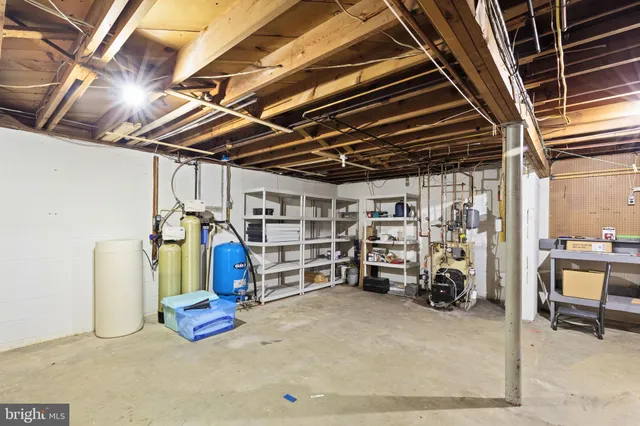 a view of a room with wooden roof and furniture