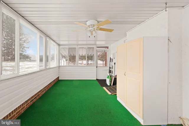 a view of an entryway with a chandelier