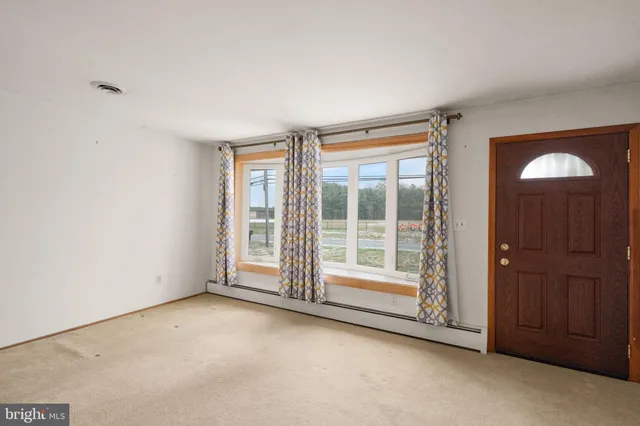 an empty room with entrance door