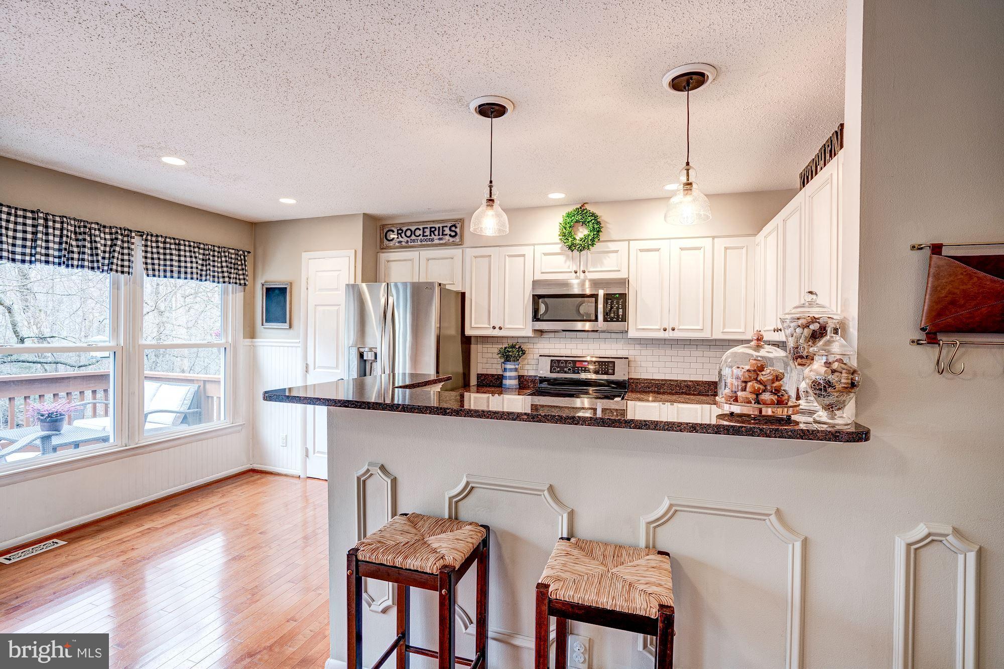 1614 Oak Spring Way Reston, VA 20190 - Photo 16 of 85 Kitchen - Wall of Windows & Breakfast Bar!