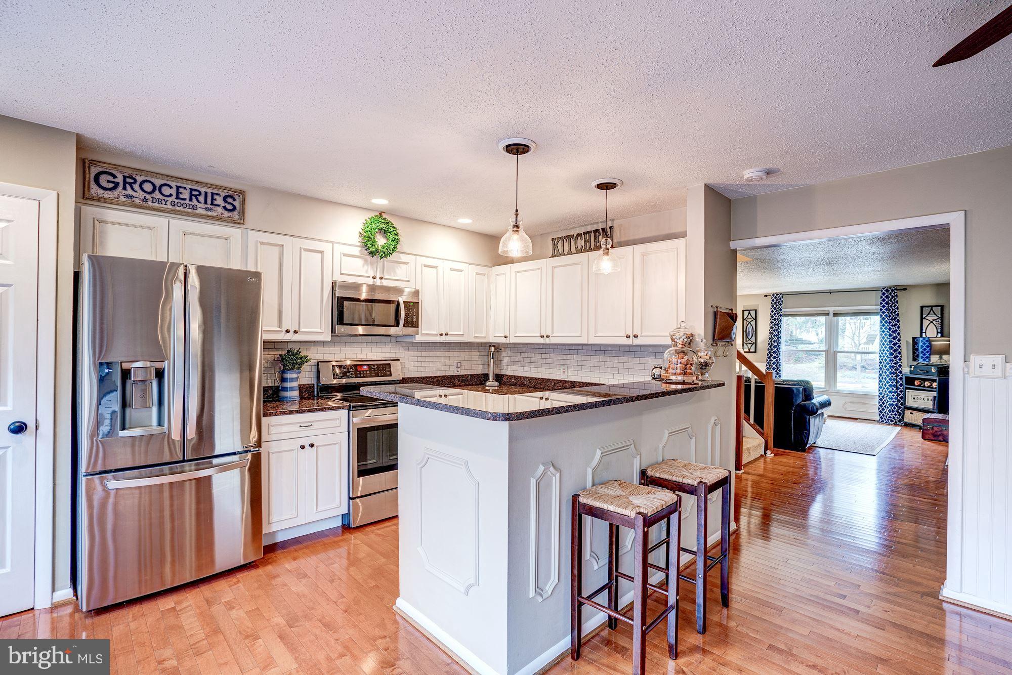 1614 Oak Spring Way Reston, VA 20190 - Photo 17 of 85 Kitchen - Hardwood Floors, Pendant Lighting!