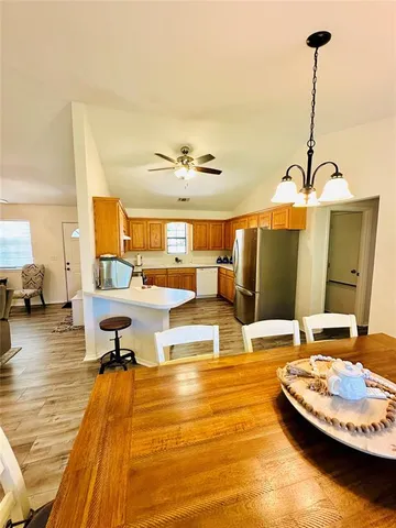 a living room with table tennis pool table and chair