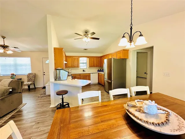 a living room with dining table