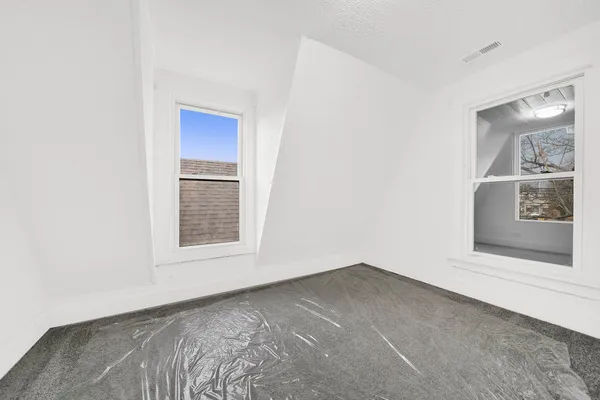 a view of an empty room and window