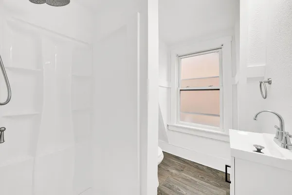 a bathroom with a sink and a window