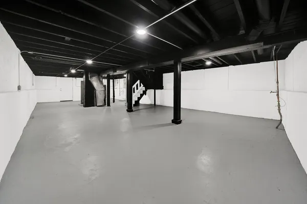 a view of water heater room with a garage